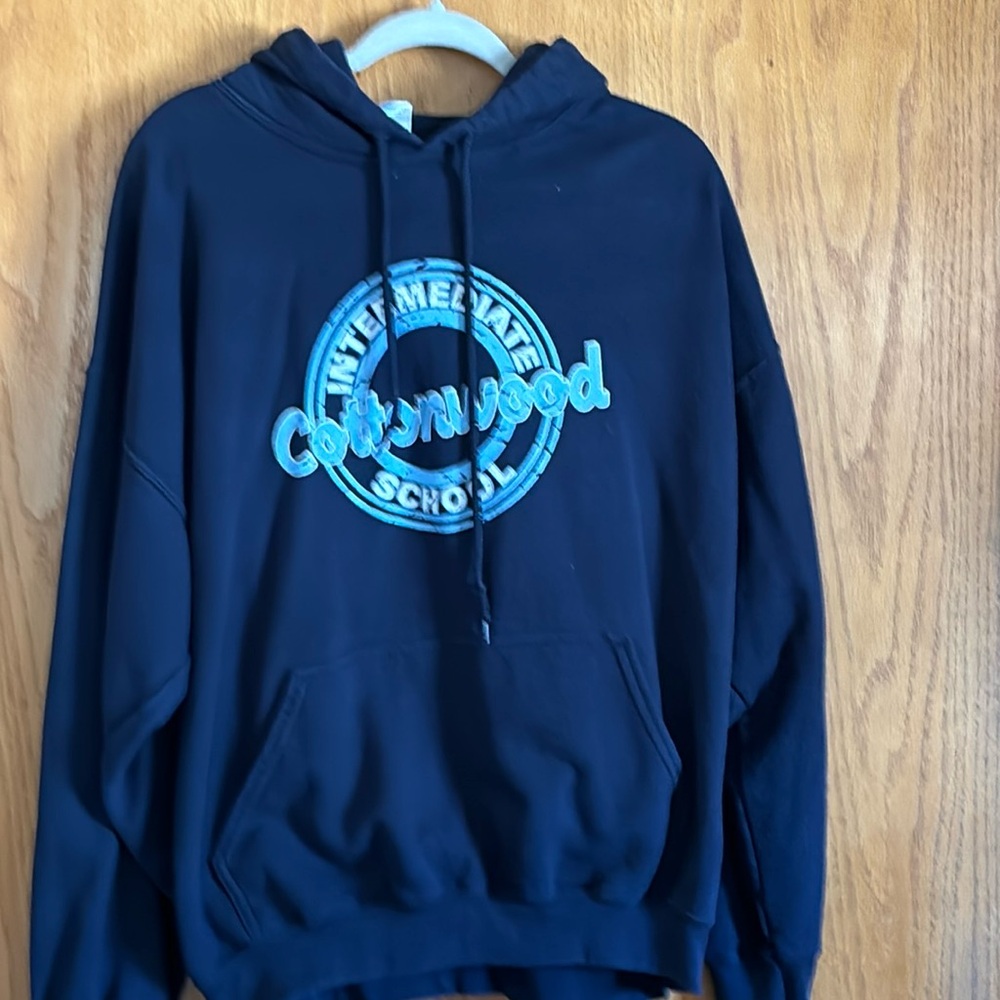 Navy Hoodie. Shows wear. Cottonwood Intermediate school. Size XL
